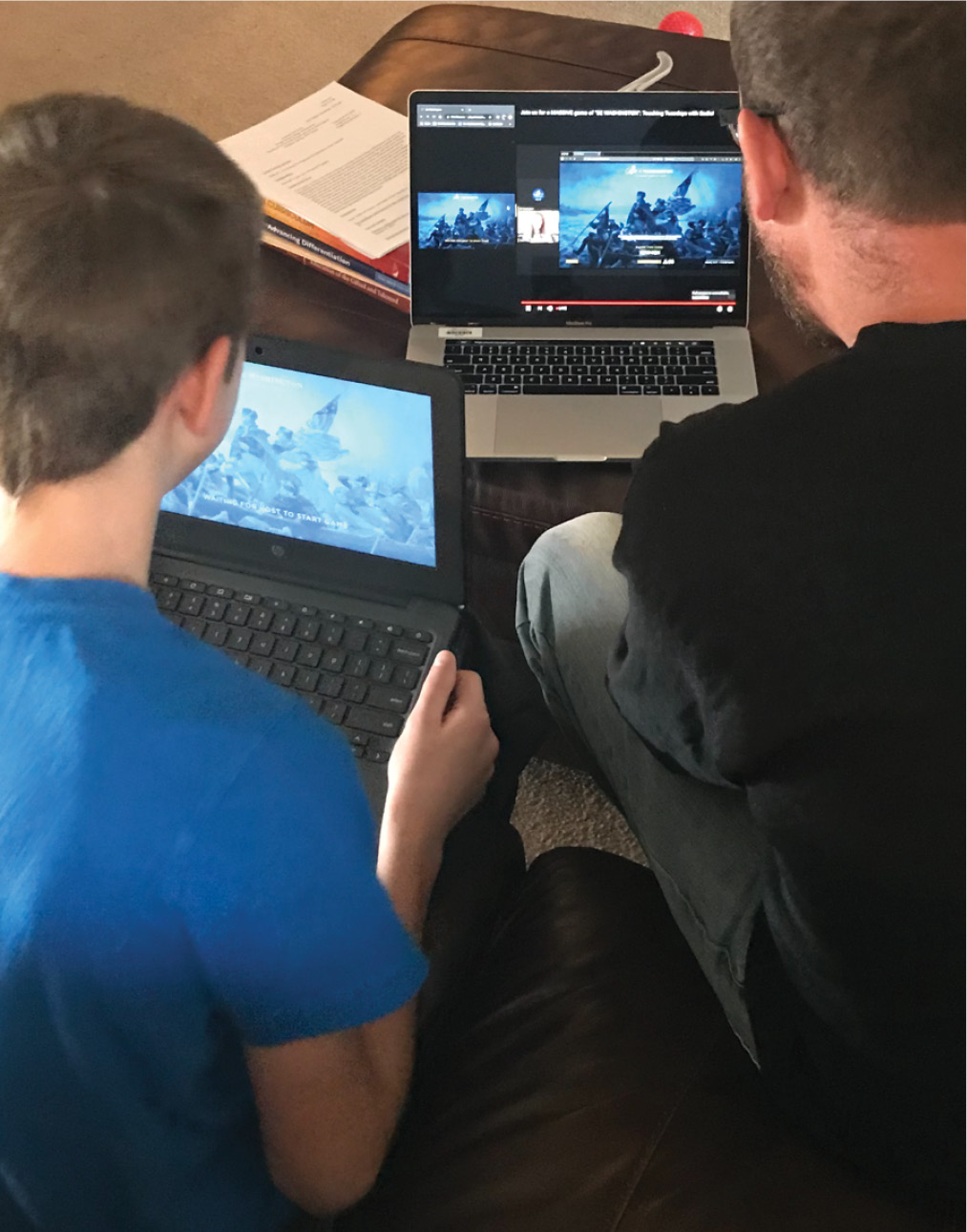 Image of father and son exploring digital resources