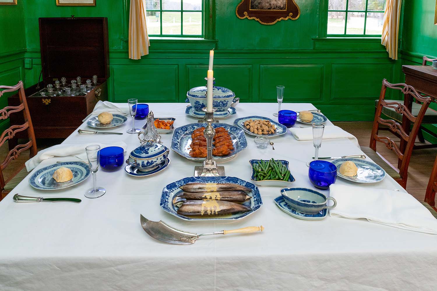 Artificial food replicas demonstrate a dinner place setting in the dining room